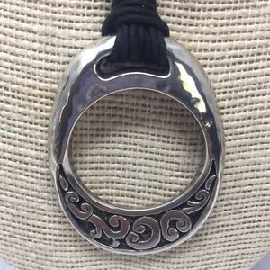 Brighton necklace pendant on cords in silver tone